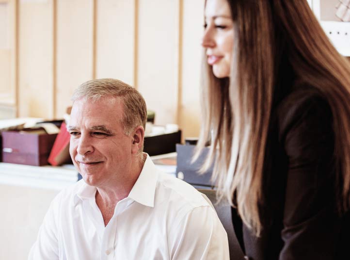 James Dondero, founder and principal of NexPoint, smiling with a professional acquaintance.